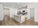 Modern kitchen features a center island, stainless appliances, and bright white cabinets at 1016 Laurens Mill Dr., Myrtle Beach, SC 29579