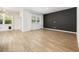 Bright living room featuring wood-look flooring and neutral walls, creating a modern and airy space at 1016 Laurens Mill Dr., Myrtle Beach, SC 29579