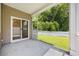 View of the screened patio, featuring a sliding glass door and a view of the backyard at 1016 Laurens Mill Dr., Myrtle Beach, SC 29579