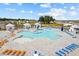 Aerial view of a resort-style pool with cabanas, lounge chairs, splash pad and other community amenities at 1016 Laurens Mill Dr., Myrtle Beach, SC 29579