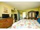 Bright bedroom features a seashell-patterned comforter, wooden furniture, and closet at 1025 Plantation Dr. # 2413/2414, Little River, SC 29566