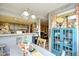 Dining area featuring a charming cabinet by the window and an open view of the kitchen at 1025 Plantation Dr. # 2413/2414, Little River, SC 29566