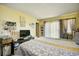 The main bedroom with plenty of space and natural light from the large sliding glass door at 1025 Plantation Dr. # 2413/2414, Little River, SC 29566