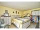 A sunny, charming main bedroom with decorative wall art and lots of natural light at 1025 Plantation Dr. # 2413/2414, Little River, SC 29566