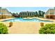 Community pool area featuring a round spa, lounge chairs, and manicured shrubs at 1025 Plantation Dr. # 2413/2414, Little River, SC 29566