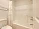 Bathroom featuring a bathtub and shower combination and light-colored fixtures and walls at 1028 Duke St., Georgetown, SC 29440