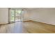 A light-filled bedroom with hardwood floors and access to an outdoor balcony at 1028 Duke St., Georgetown, SC 29440