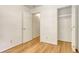 Bedroom with hardwood floors, closet, and neutral walls, offering a versatile space at 1028 Duke St., Georgetown, SC 29440