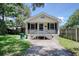 Inviting single-story home with a quaint porch and well-maintained front yard at 1028 Duke St., Georgetown, SC 29440