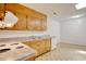Functional kitchen featuring wooden cabinets, grey countertops, and linoleum floors at 1028 Duke St., Georgetown, SC 29440