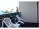 Balcony featuring 2 chairs with views of palm trees and the ocean at 1105 S Ocean Blvd. # 218, Myrtle Beach, SC 29577