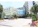 The Coral Beach Resort features an inviting entrance, showcasing tropical landscaping and covered parking at 1105 S Ocean Blvd. # 218, Myrtle Beach, SC 29577