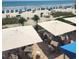 View of patio dining area with umbrellas overlooking a beach at 1105 S Ocean Blvd. # 218, Myrtle Beach, SC 29577