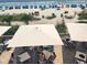 Patio dining area overlooking the beach, ocean, and palm trees at 1105 S Ocean Blvd. # 218, Myrtle Beach, SC 29577