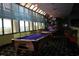 Billiard room with multiple pool tables and large windows, perfect for leisure and entertainment at 1105 S Ocean Blvd. # 218, Myrtle Beach, SC 29577