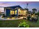 The backyard has a stone patio, outdoor grill, green grass and garden at 117 Black Water Dr., Murrells Inlet, SC 29576