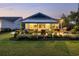 The backyard has a stone patio, outdoor grill, green grass and garden at 117 Black Water Dr., Murrells Inlet, SC 29576