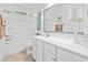 Clean bathroom featuring a white vanity with ample storage, a large mirror, and a shower-tub combination at 117 Black Water Dr., Murrells Inlet, SC 29576