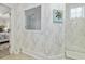Modern bathroom with stylish wallpaper, glass-enclosed shower, and contemporary fixtures at 117 Black Water Dr., Murrells Inlet, SC 29576