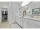 Elegant bathroom featuring double sinks, quartz countertops, and a walk-in closet at 117 Black Water Dr., Murrells Inlet, SC 29576