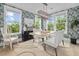 Bright dining room with decorative wallpaper, large windows, and stylish light fixture at 117 Black Water Dr., Murrells Inlet, SC 29576