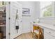 Bright office featuring white desk, chair, and storage shelves at 117 Black Water Dr., Murrells Inlet, SC 29576
