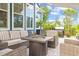 The outdoor patio has comfortable seating around a fire pit and a view of the backyard at 117 Black Water Dr., Murrells Inlet, SC 29576
