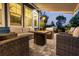 Outdoor patio with fire pit, sofa, grill and comfortable seating beneath a retractable awning at 117 Black Water Dr., Murrells Inlet, SC 29576