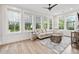 Inviting sunroom filled with natural light, comfortable seating, and stylish decor at 117 Black Water Dr., Murrells Inlet, SC 29576