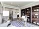 Bright home office space with classic book shelves and lots of natural light, perfect for your work from home setup at 1291 Piper Glen Dr, Sunset Beach, NC 28468