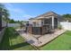 Spacious backyard with patio, hot tub, grill, and well-manicured lawn for outdoor enjoyment at 1301 Camlet Ln., Little River, SC 29566