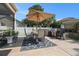 Outdoor patio with grill, dining furniture, and umbrella, perfect for entertaining at 1301 Camlet Ln., Little River, SC 29566