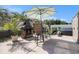 Backyard retreat with firepit, dining area, umbrella, and lush greenery, creating an inviting ambiance at 1301 Camlet Ln., Little River, SC 29566