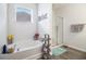 Bright bathroom featuring a soaking tub, a glass shower, and wood-look tile flooring at 1301 Camlet Ln., Little River, SC 29566