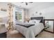 Bedroom with lots of light, decorative mirror on the right, and a floral curtain at 1301 Camlet Ln., Little River, SC 29566