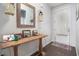 Welcoming entryway with hardwood floors, mirror, lamps, console table, and decor at 1301 Camlet Ln., Little River, SC 29566