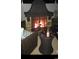 Cozy outdoor fireplace with seating and table, perfect for relaxing evenings at 1301 Camlet Ln., Little River, SC 29566