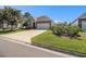 Charming home exterior with stone accents, inviting curb appeal, and a well-maintained lawn at 1301 Camlet Ln., Little River, SC 29566