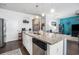 Open-concept kitchen featuring a granite island, modern appliances, and seamless integration with the living area at 1301 Camlet Ln., Little River, SC 29566