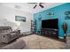 Cozy living room showcasing a stylish accent wall, comfortable seating, and a relaxing atmosphere at 1301 Camlet Ln., Little River, SC 29566