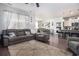 Spacious living room featuring hardwood floors, a comfortable seating arrangement, and a seamless flow to the kitchen at 1301 Camlet Ln., Little River, SC 29566