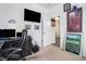 This is an office space with a computer chair, TV, and golf pictures on the wall at 1301 Camlet Ln., Little River, SC 29566