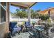 Screened-in porch featuring comfortable seating, patterned rug, and serene backyard view at 1301 Camlet Ln., Little River, SC 29566