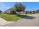 Charming home with lush front lawn, blooming tree, and well-maintained landscaping at 1301 Camlet Ln., Little River, SC 29566