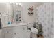 Bathroom with a single sink vanity, tile floors, and a decorative shower curtain at 1311 Turkey Ridge Rd. # A, Surfside Beach, SC 29575