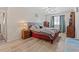 Comfortable bedroom with a ceiling fan, hardwood floors, and ample natural light at 1311 Turkey Ridge Rd. # A, Surfside Beach, SC 29575