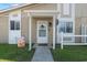 Up close exterior shot of front door with welcome mat and pleasant welcome sign at 1311 Turkey Ridge Rd. # A, Surfside Beach, SC 29575