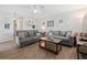 Bright living room with neutral walls, wood floors, comfortable sofas, and ceiling fan at 1311 Turkey Ridge Rd. # A, Surfside Beach, SC 29575