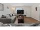 Large living room with lots of light and cozy furniture and wood floors at 1311 Turkey Ridge Rd. # A, Surfside Beach, SC 29575