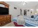 Spacious main bedroom with a ceiling fan, wood-look floors and en-suite bathroom at 1311 Turkey Ridge Rd. # A, Surfside Beach, SC 29575